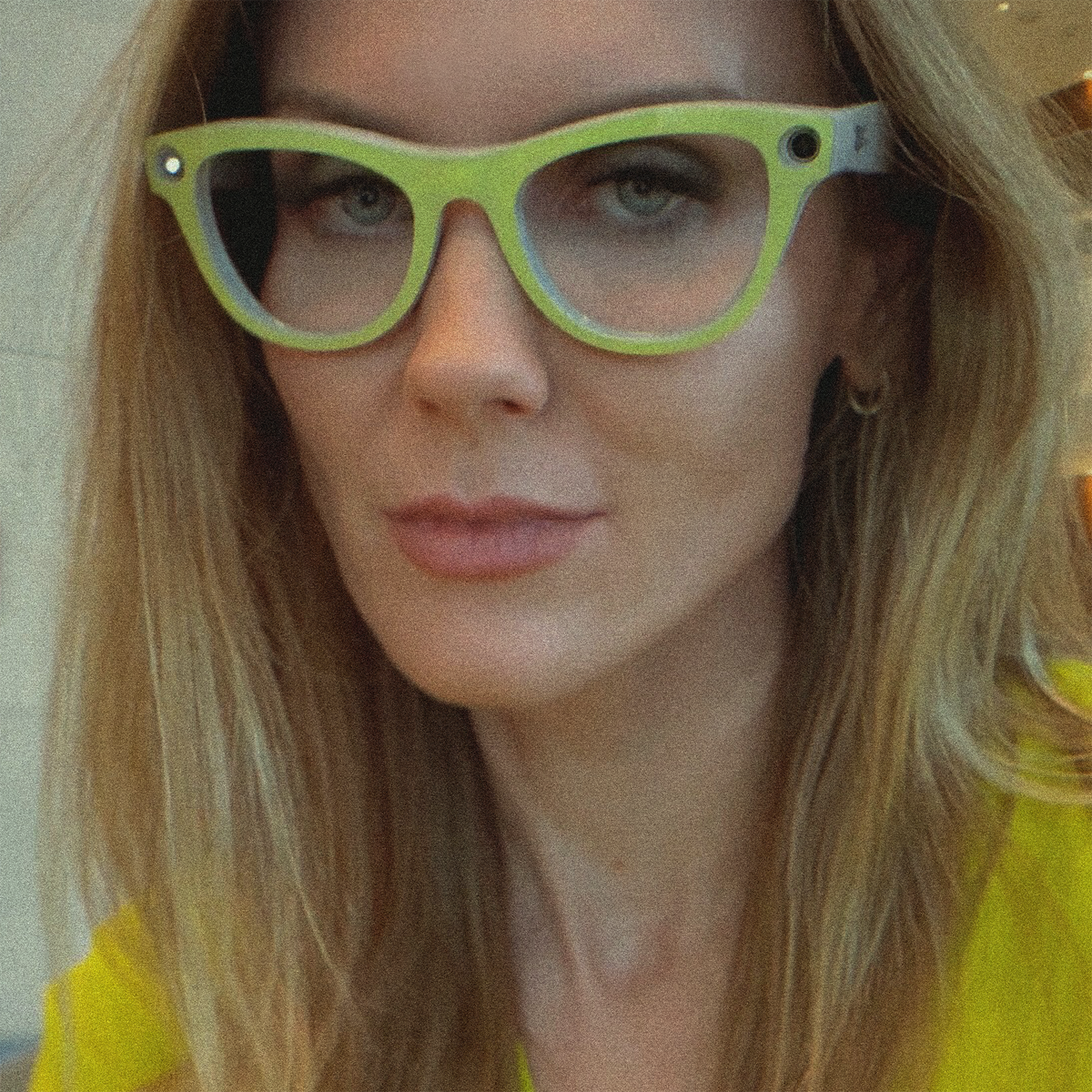 woman wearing Chartreuse Gloss yellow-green AI glasses wrap on Ray-Ban Meta skyler glasses